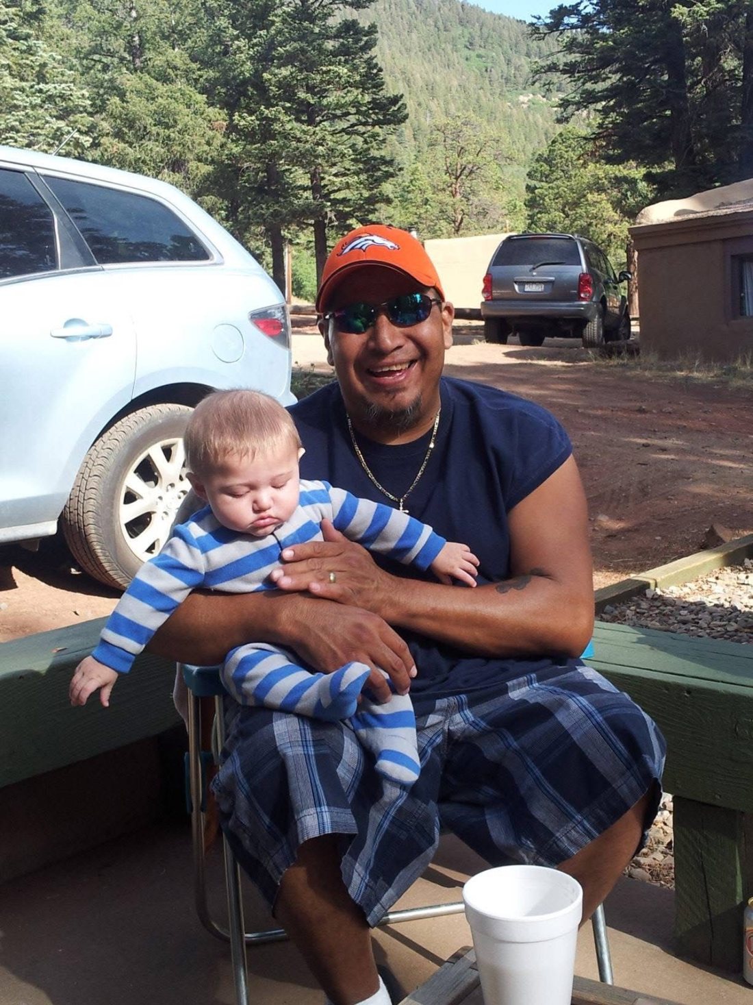 Holding the baby at the cabin